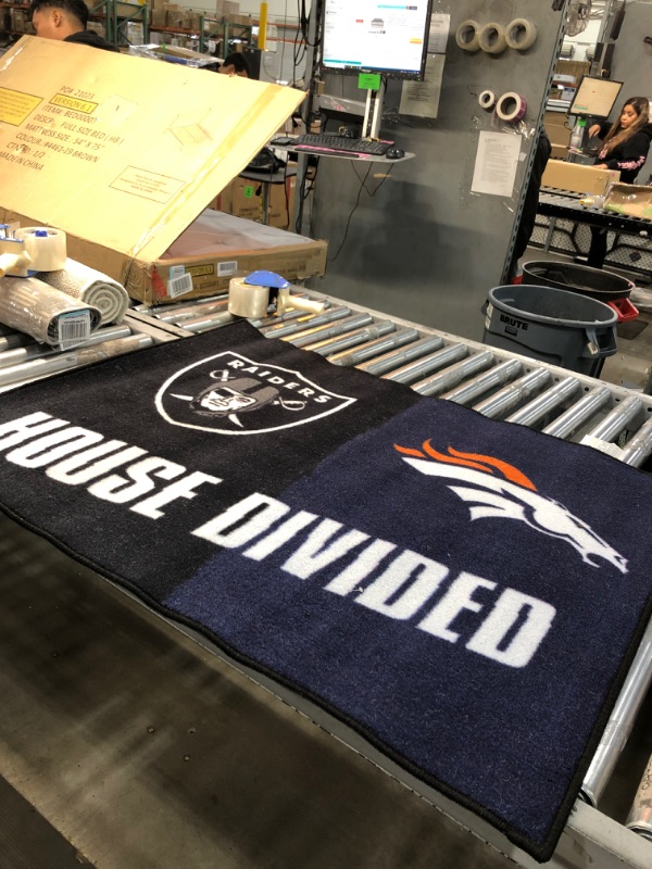 Photo 2 of 
FANMATS 15665 Team Color 33.75" x 42.5" Rug (NFL ) SEE PHOTO FOR ACTUAL TEAMS, RAIDERS/BRONCOS