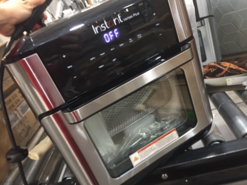 Photo 3 of **BOTTOM LEFT SIDE OF FRYER HAS A MINOR DENT**
Instant Vortex Plus 10 Quart Air Fryer, Rotisserie and Convection Oven, Air Fry, Roast, Bake, Dehydrate and Warm, 1500W, Stainless Steel and Black
