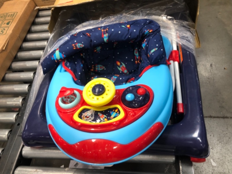 Photo 2 of **MISSING ONE BUTTON TO KEEP SEAT IN PLACE**SIMILAR  TO STOCK PHOTO**

Storkcraft 3-in-1 Activity Walker and Rocker with Jumping Board and Feeding Tray, Interactive Walker with Toy Tray and Jumping Board for Toddlers and Infants, Blue/Gray
