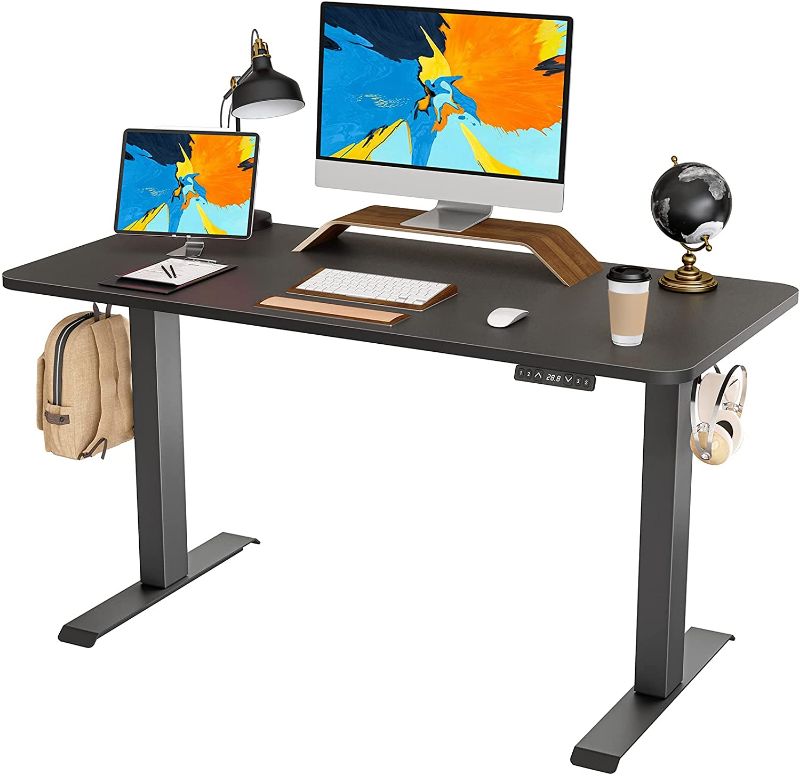 Photo 1 of FAMISKY Standing Desk Dual Motors, Adjustable Height Electric Stand up Desk, 48 x 24 Inches Sit Stand Home Office Desk, Ergonomic Workstation Black Steel Frame/Black Wood Tabletop
