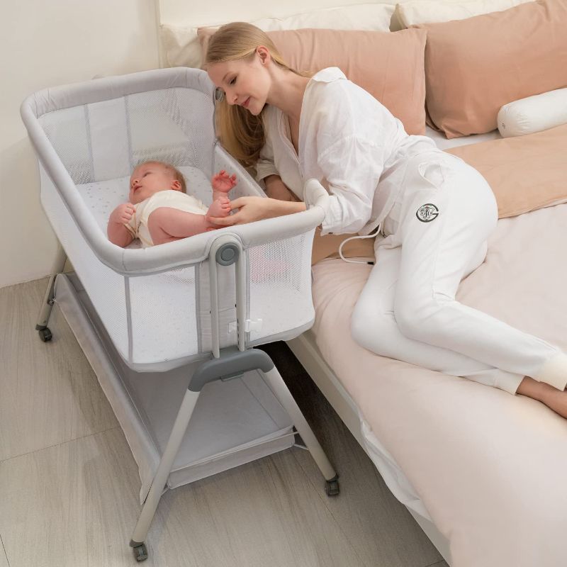 Photo 1 of ANGELBLISS Baby Bassinet Bedside Crib, Easy Folding Bed Side Sleeper with Wheels Adjustable Height Portable Bassinet for Newborn Babies Infants, Included...
