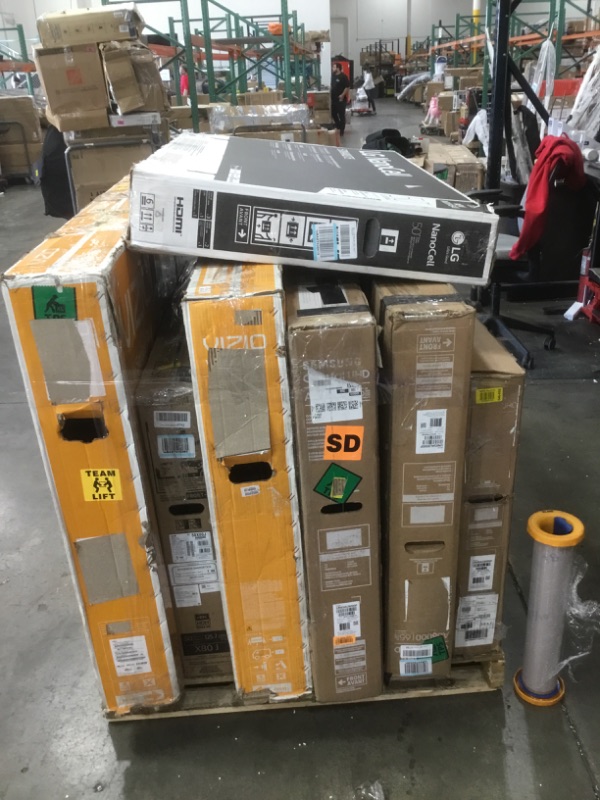 Photo 1 of Pallet of broken and damaged tvs. Sold as is for parts