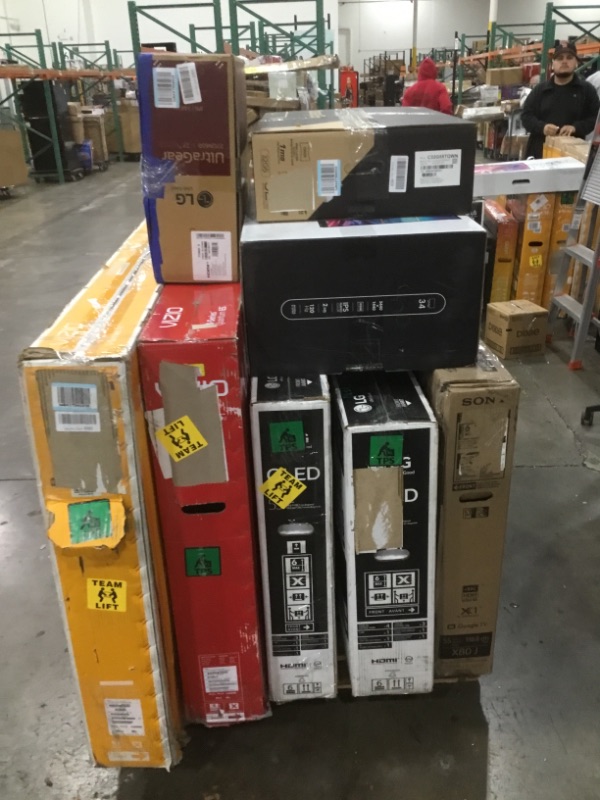 Photo 2 of Pallet of assorted damaged TVs and monitors. Sold as is. Non refundable