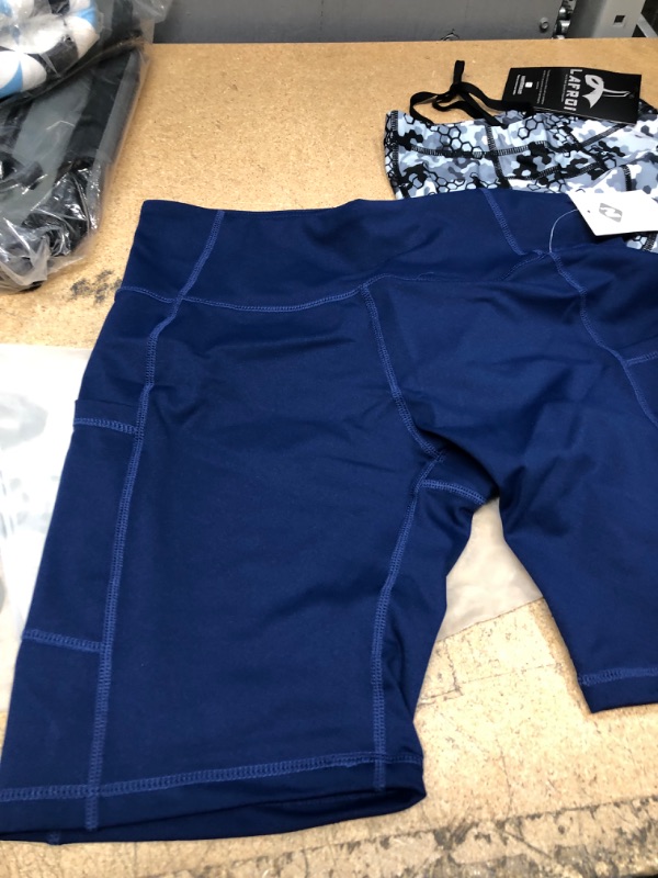 Photo 3 of Women's Running Leggings 
Blue Large Shorts, Small Grey Pants 