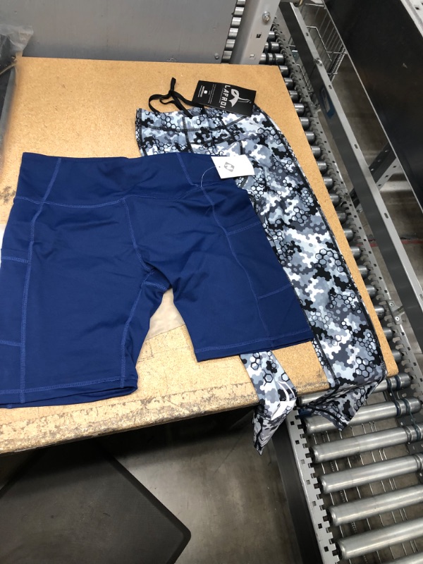 Photo 1 of Women's Running Leggings 
Blue Large Shorts, Small Grey Pants 