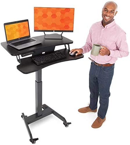 Photo 1 of Stand Steady Electric Mobile Podium with Keyboard Tray | Height Adjustable Stand Up Workstation with Locking Wheels | Go from Sitting to Standing with Programmable Pad (Black)
