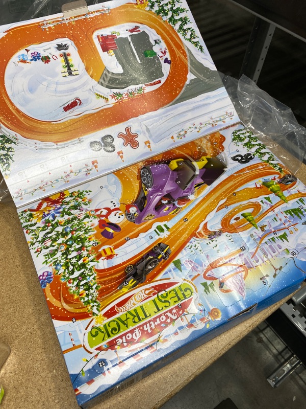 Photo 2 of Hot Wheels 2021 Advent Calendar with 24 Surprises That Include 8 1:64 Scale Vehicles & Other Cool Accessories, Plus a Play Pane Mat, for Collectors & Kids 3 Years Old & Up
