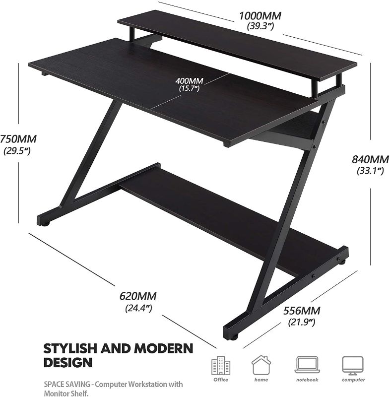 Photo 1 of FITUEYES Unique Z-Shaped 40" Computer Desk with 2-Monitor Shelf & Bottom Storage Shelves, Small Desk for Small Spaces, Compact Study Writing Table for Home Office, Black
