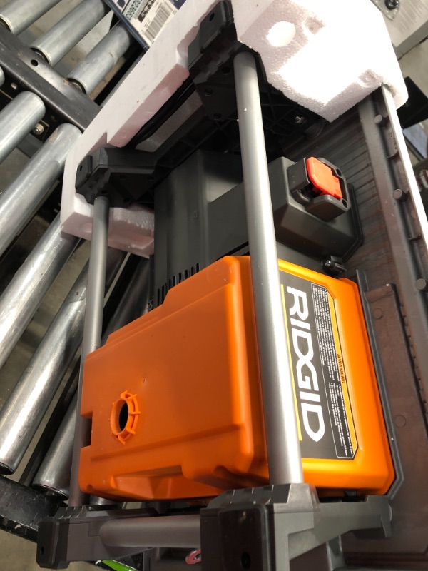 Photo 1 of Ridgid R4021 120-Volt 6.5 Amp Corded 7 Inch Self-Aligning Table Top Wet Tile Saw (New Open Box)