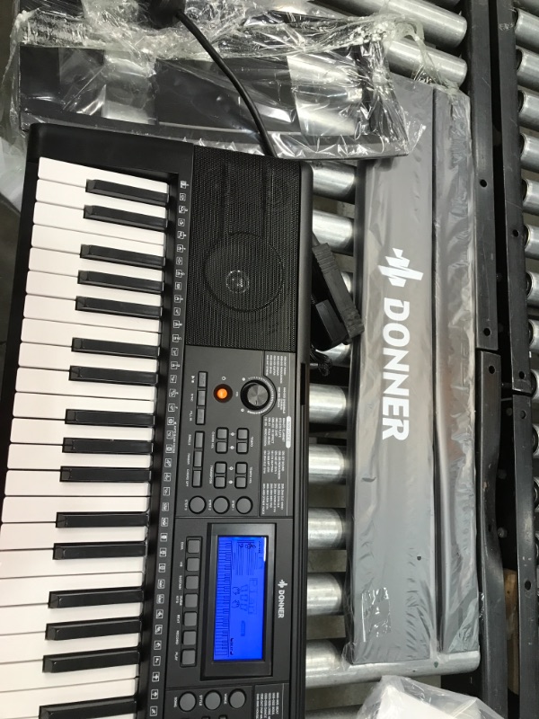 Photo 1 of Donner 61 Key Piano Keyboard, Keyboard Piano for Beginner/Professional, Electric Keyboard with Piano Stand, Stool and Microphone, Supports MP3/USB MIDI/Audio/Microphone/Headphones/Sustain Pedal