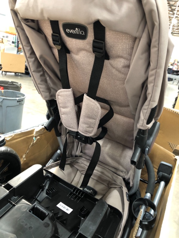 Photo 1 of Evenflo Pivot Modular Travel System with SafeMax Infant Car Seat - Sandstone