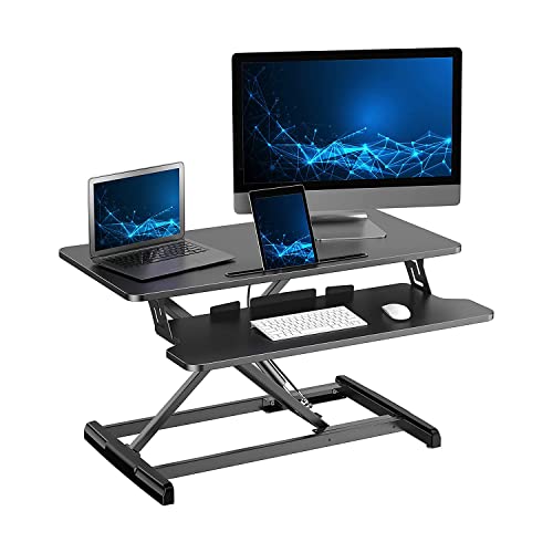 Photo 1 of ATUMTEK Standing Desk Converter, 32 Inch Height Adjustable Sit to Stand Desk