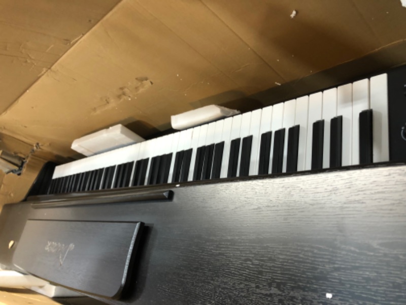 Photo 1 of Donner DDP-100 88-Key Weighted Action Digital Piano, Beginner Bundle with Furniture Stand, Power Adapter, Triple Pedals, MP3 Function, Black ***MISSING LEG***

