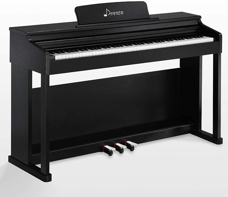 Photo 1 of Donner DDP-100 88-Key Weighted Action Digital Piano, Beginner Bundle with Furniture Stand, Power Adapter, Triple Pedals, MP3 Function, Black ***MISSING LEG***
