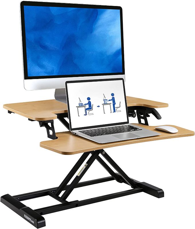 Photo 1 of FLEXISPOT Standing Desk Converter 28" Height Adjustment Desk Riser with Deep Keyboard Tray for Laptop,Sit Stand Home Office Desk Workstation (28", Bamboo Texture, M7F)
