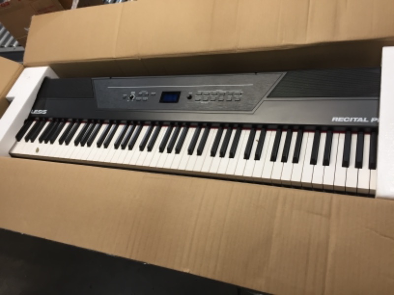 Photo 2 of Alesis Recital Pro - 88 Key Digital Piano Keyboard with Hammer Action Weighted Keys, 2x20W Speakers, 12 Voices, Record and Lesson Mode, FX and Display
