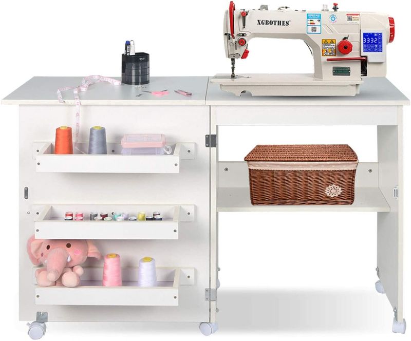 Photo 1 of Folding Sewing Table Multifunctional Sewing Machine Cart Table Sewing Craft Cabinet with Storage Shelves Portable Rolling Sewing Desk Computer Desk with Lockable Casters(White)
**loose missing hardware**