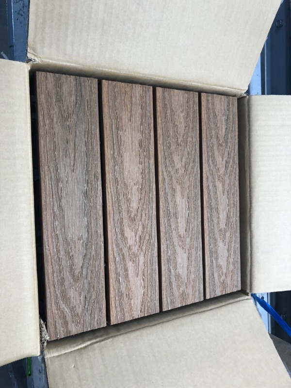 Photo 2 of 10 boxes of NewTechWood
UltraShield Naturale 1 ft. x 1 ft. Quick Deck Outdoor Composite Deck Tile in Peruvian Teak (10 sq. ft. Per Box), sold as is, Non-refundable


