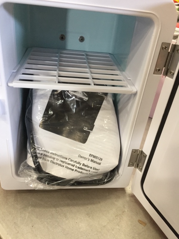 Photo 1 of 0.3 cu. ft. 6-Can Retro Mini Fridge in Red
little buff marks  on top