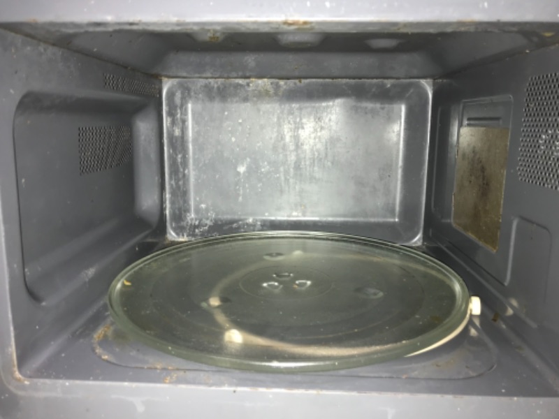 Photo 2 of 1.1 cu. ft. Countertop Microwave in Black with Gray Cavity
**USED, DOES NOT FUNCTION OR TURN ON, FOR PARTS ONLY**