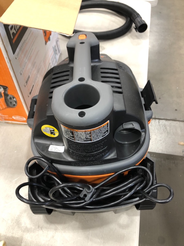 Photo 2 of RIDGID 4 Gallon 5.0-Peak HP Portable Wet/Dry Shop Vacuum with Fine Dust Filter, Hose and Accessories, Oranges/Peaches

//MISSING ALL ACCESSORIES 
