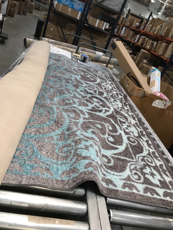 Photo 1 of 7ft long area rug, blue and gray