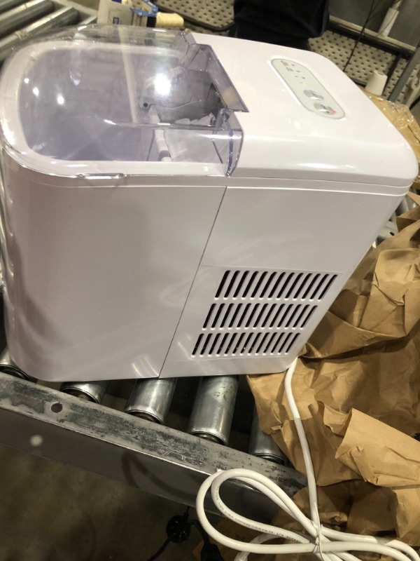 Photo 3 of **used**
Igloo ICEB26WH Automatic Portable Electric Countertop Ice Maker Machine, 26 Pounds in 24 Hours, 9 Cubes Ready in 7 minutes, With Scoop and Basket, Perfect for Water Bottles, Mixed Drinks, Parties, WHT
