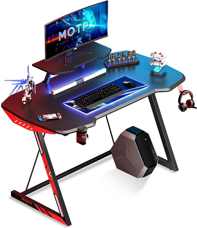 Photo 1 of MOTPK 39 inch Ergonomic Gaming Desk Z-Shaped Sturdy Computer Table, Gaming Workstation Home Office Desk with Monitor Stand Cup Holder and Headphone Hook
