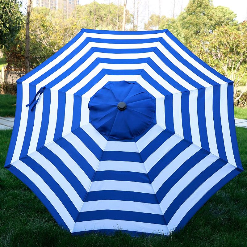 Photo 1 of **ACTUAL UMBRELLA IS A DARKER SHADE OF BLUE**
Blissun 9' Outdoor Aluminum Patio Umbrella, Market Striped Umbrella with Push Button Tilt and Crank

AT THE TILT IT IS DAMAGED
