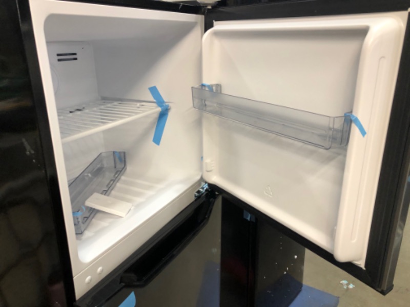 Photo 3 of **FRIDGE HAS MINOR DENTS ON CORNNERS, BOTTOM FRIDGE DOOR IS DIFFICULT TO OPEN **
Danby DFF070B1BSLDB-6 7.0 Cu.Ft. Mid-Size Refrigerator, Frost-Free Apartment Fridge with Top Freezer, E-Star Rated, 7, Black Stainless Look
