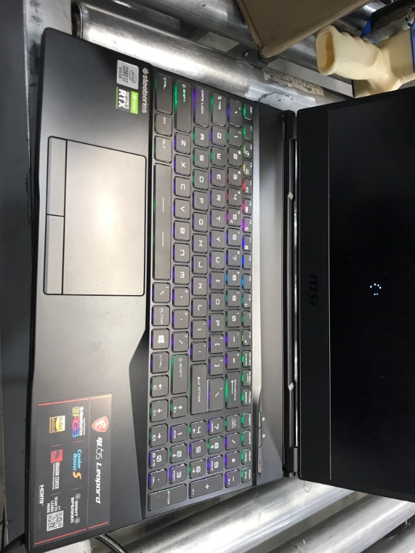 Photo 6 of **USED, NO PAMPHLETS, OR ORIGINAL PACKAGE** BOTTOM OF LAPTOP HAS 12 SCREWS  ATTACHED**
MSI GF65 Gaming Laptop: 15.6" 144Hz FHD 1080p, Intel Core i7-10750H 6 Core, NVIDIA GeForce RTX 3060, 16GB, 512GB NVMe SSD, WiFi 6, Red Keyboard, Win 10, Black (10UE-047