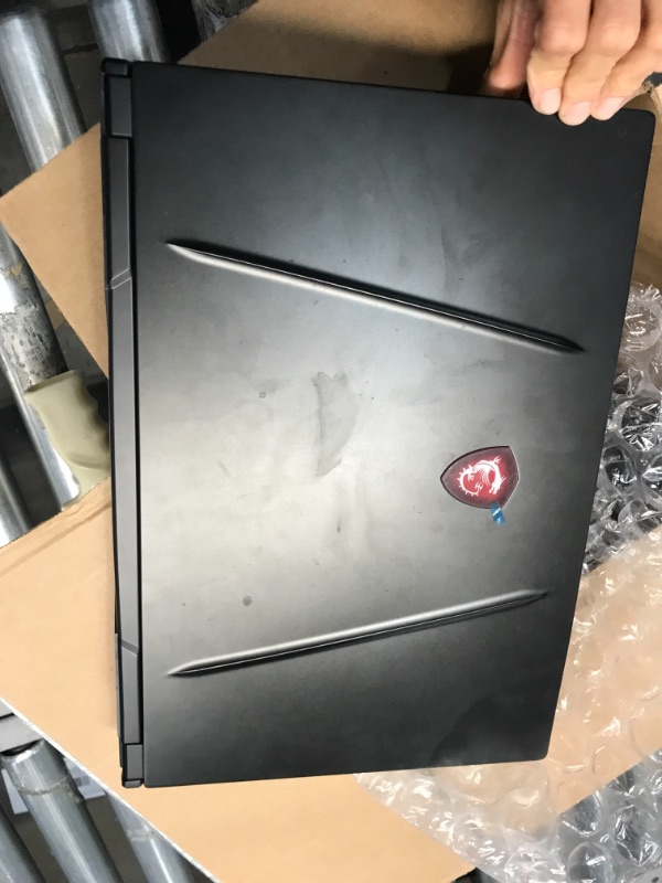 Photo 3 of **USED, NO PAMPHLETS, OR ORIGINAL PACKAGE** BOTTOM OF LAPTOP HAS 12 SCREWS  ATTACHED**
MSI GF65 Gaming Laptop: 15.6" 144Hz FHD 1080p, Intel Core i7-10750H 6 Core, NVIDIA GeForce RTX 3060, 16GB, 512GB NVMe SSD, WiFi 6, Red Keyboard, Win 10, Black (10UE-047