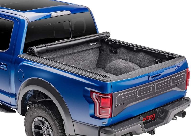 Photo 1 of **PREVIOUSLY USED, MINOR DENTS**
Extang Revolution Soft Roll-up Truck Bed Tonneau Cover | 54422 | Fits 2019 - 2021 Dodge RAM, "New Body Style" (does not fit with multifunction tailgate) 6' 4" Bed (76.3")
