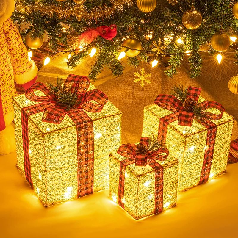 Photo 1 of Sunnyglade 10"-8"-6" Set of 3 Christmas Lighted Gift Boxes Decoration Boxes with Plug, Bows, Artificial Pine Leaves and Pine Cones for Christmas, Weddings Yard Home Holiday Art Decoration
