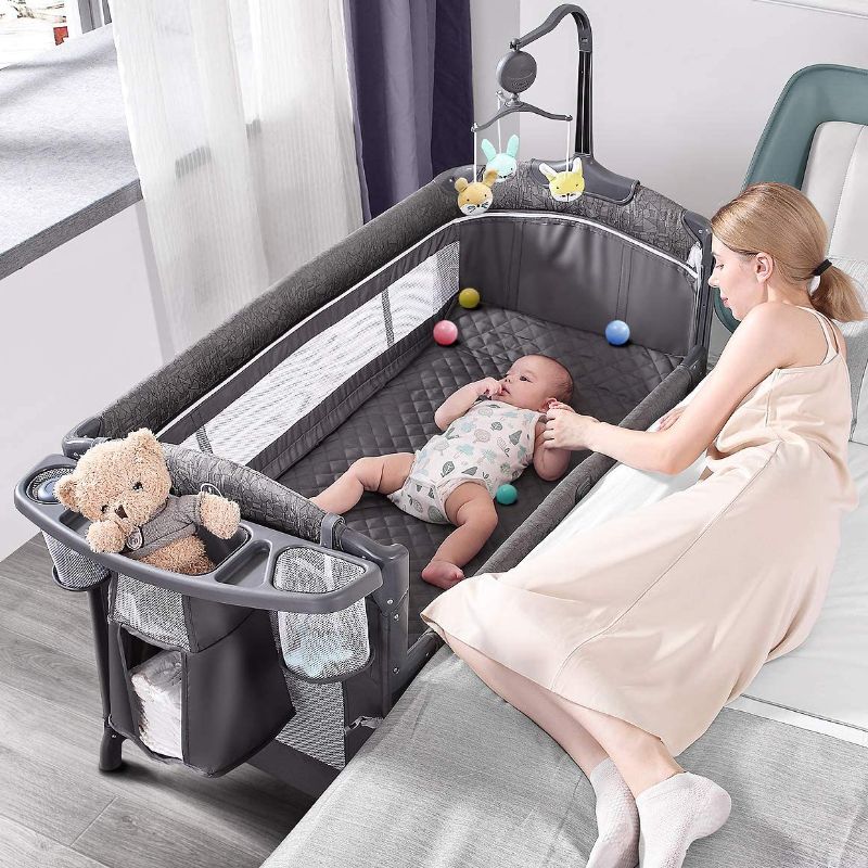 Photo 1 of ADOVEL Baby Bassinet Bedside Crib, Pack and Play with Mattress, Diaper Changer and Playards from Newborn to Toddles 30.67 x 10.98 x 10.59 inches

