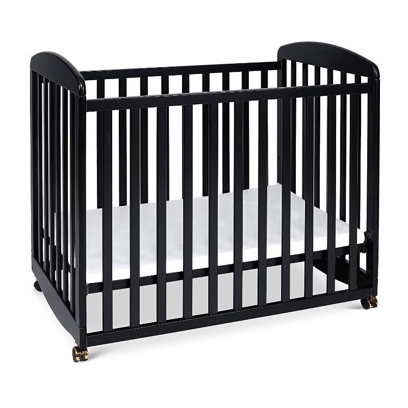 Photo 2 of Davinci Alpha Mini Rocking Crib in Ebony, Removable Wheels, Greenguard Gold Certified

White & Black