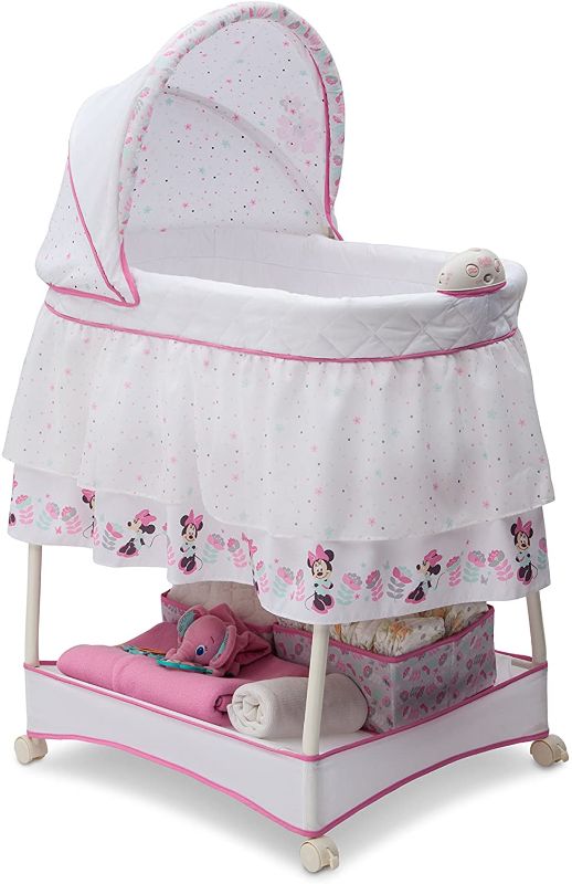 Photo 1 of Delta Children Gliding Bedside Bassinet - Portable Crib with Lights, Sounds and Vibration, Disney Minnie Mouse Boutique

//mattress is damaged 
