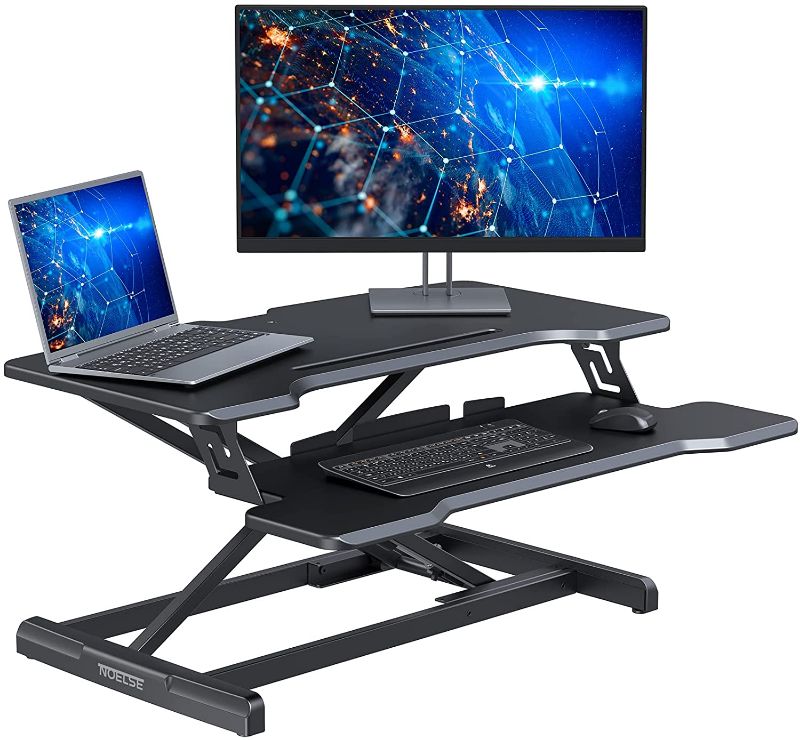 Photo 1 of Standing Desk Converter Noelse 30” Dual Tier Standing Desk Riser for Home Office, Black Spring Loaded Height Adjustable Desk with Wide Keyboard Tray
