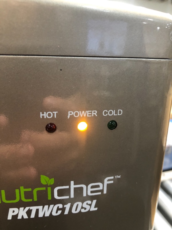 Photo 1 of NO JUG INCLUDED 
Nutrichef Countertop Water Cooler Dispenser - Hot & Cold Water, with Child Safety Lock, Black-Chrome
tested and working 