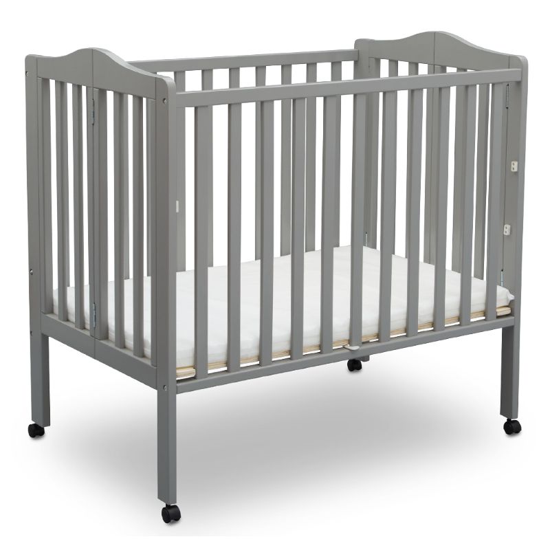 Photo 1 of Delta Children Folding Portable Crib with Mattress Grey