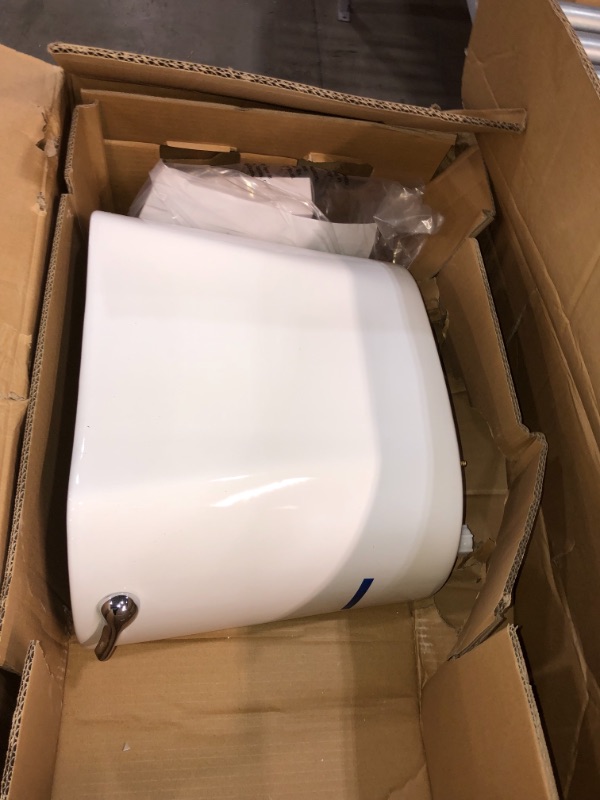 Photo 3 of 2-piece 1.1 GPF/1.6 GPF High Efficiency Dual Flush Complete Elongated Toilet in White, Seat Included.