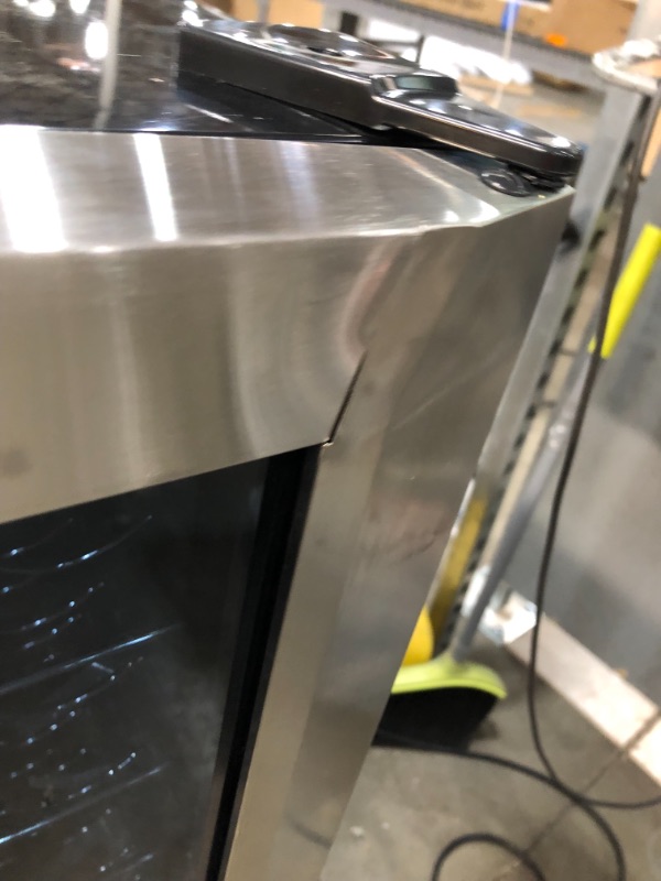 Photo 1 of **MINOR DENTS TO FRAME**
50-Bottle Wine Cooler in Stainless Steel
