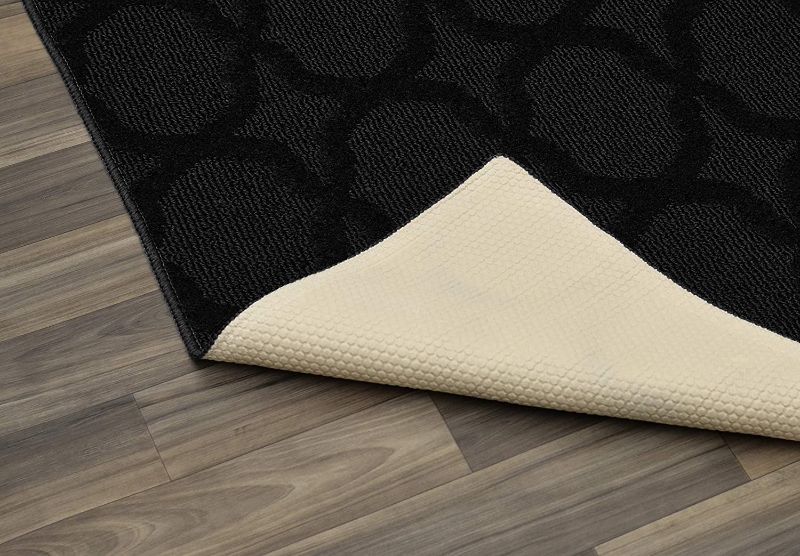 Photo 1 of **ACTUAL RUG HAS A DIFFERENT DESIGN FROM STOCK PHOTO, REFER TO PHOTO*
6'X9' SOLID BLACK RUG WITH DIAMOND DESIGN AND RUBBER BOTTOM