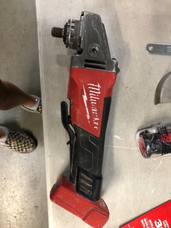 Photo 6 of ***PARTS ONLY*** M18 FUEL 18-Volt Lithium-Ion Brushless Cordless 4-1/2 in./5 in. Grinder w/Paddle Switch (Tool-Only)
AS IS USED, COSMETIC DAMAGE, PLEASE SEE PHOTOS 