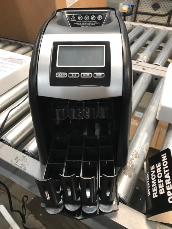 Photo 2 of Royal Sovereign FS-44P 4 Row Coin Sorter with Auto Row Advancement, Digital Count Display, and Optional Printer Attachment
NOT FUNCTIONAL, COINS STUCK INSIDE.