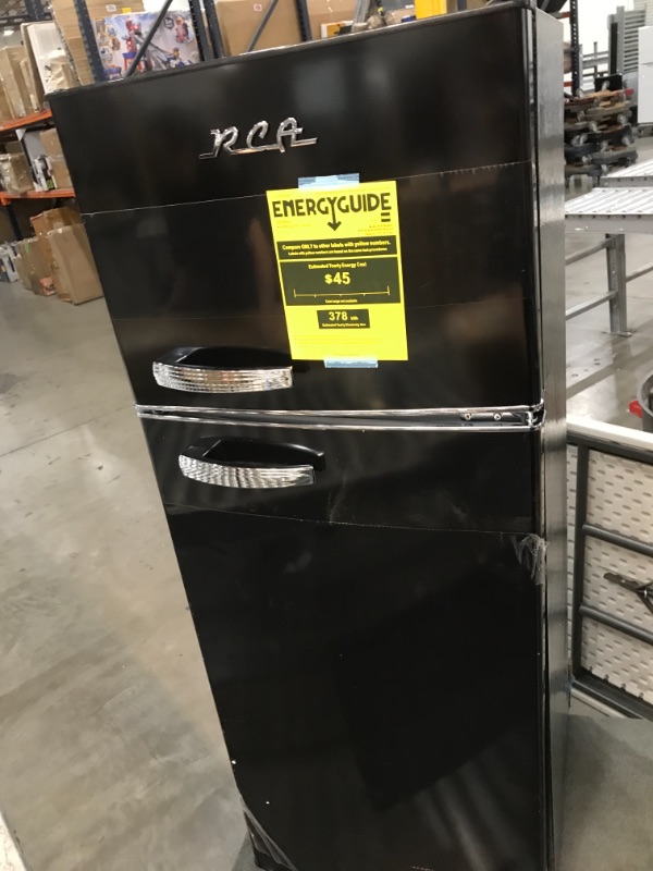 Photo 2 of RCA RFR786-BLACK 2 Door Apartment Size Refrigerator with Freezer, 7.5 cu. ft, Retro Black
BROKEN DOOR.