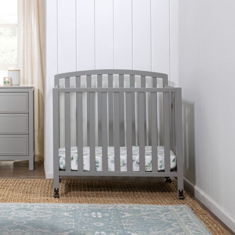 Photo 1 of DaVinci Dylan Folding Portable 3-in-1 Convertible Mini Crib and Twin Bed in Grey, Greenguard Gold Certified
