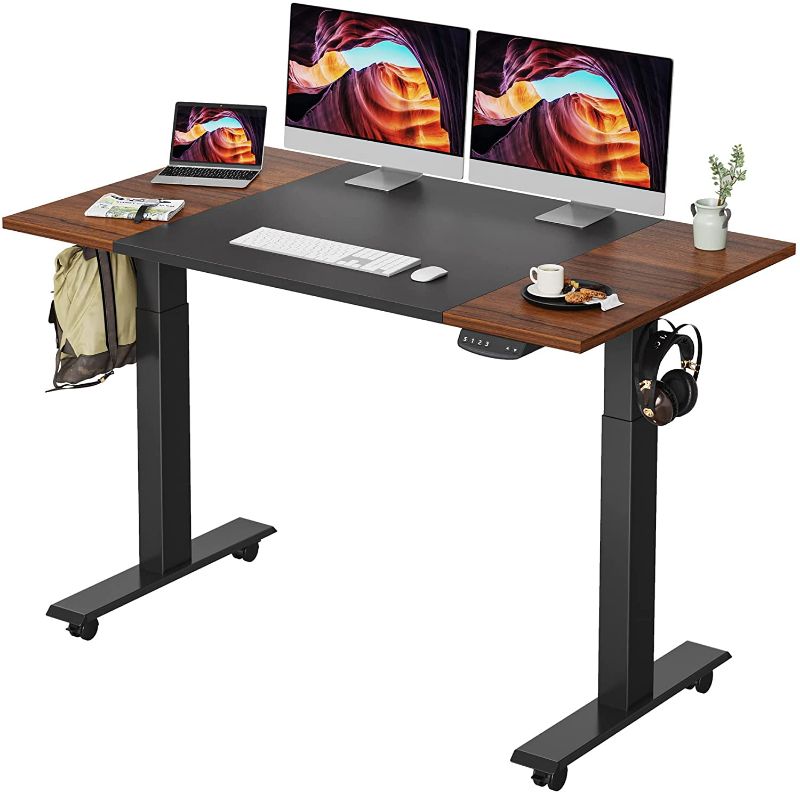 Photo 1 of FEZIBO Height Adjustable Electric Standing Desk with Pencil Holder, 55 x 24 Inches Stand Up Desk, Sit Stand Desk with Espresso and Black Top and Black Frame
