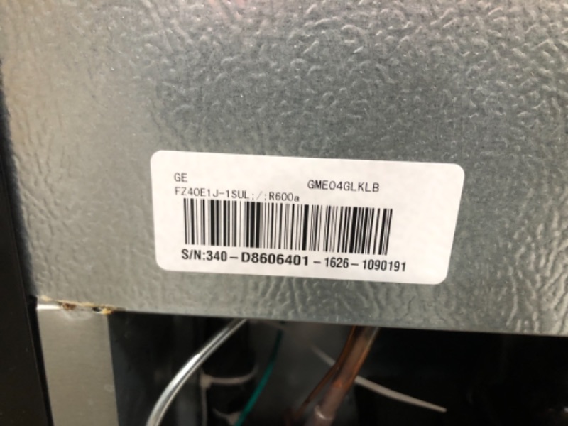 Photo 5 of GE GME04GLKLB Mini Fridge 4.4 Cubic Ft. Single Design with Glass Shelves, in-Door Can Rack & Small Freezer Small Refrigerator Perfect for The Garage, Dorm Room, or Bedroom Clean Steel, Cu
