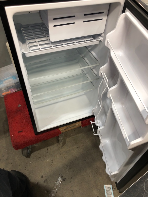 Photo 2 of GE GME04GLKLB Mini Fridge 4.4 Cubic Ft. Single Design with Glass Shelves, in-Door Can Rack & Small Freezer Small Refrigerator Perfect for The Garage, Dorm Room, or Bedroom Clean Steel, Cu
